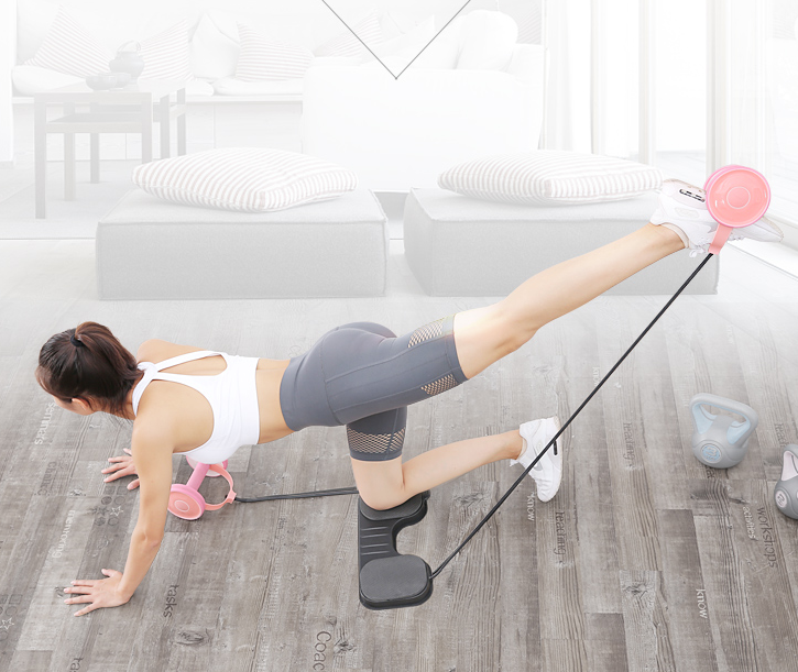 Woman exercising with resistance bands in a home setting