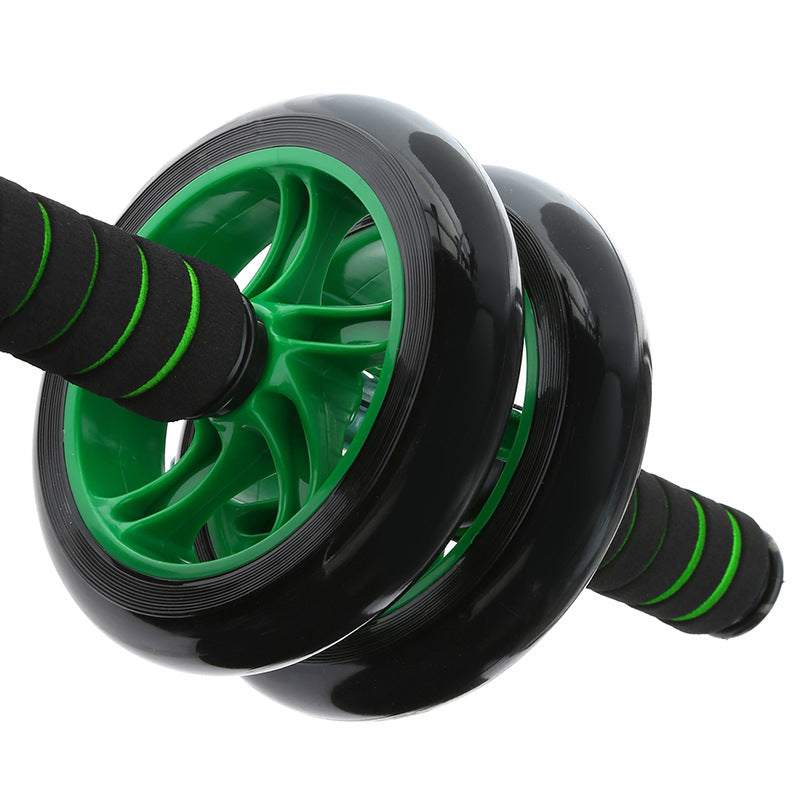 Black and green ab roller on a white background