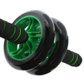 Black and green ab roller on a white background