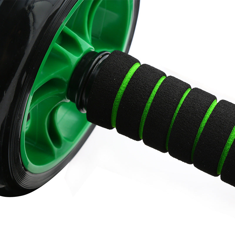 Green and black ab roller on a white background