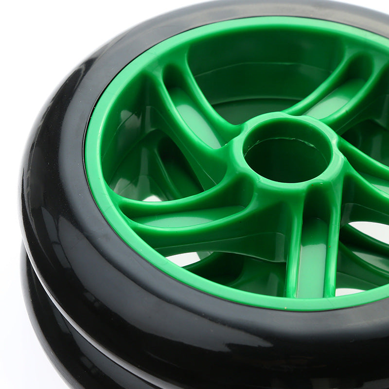 Close-up of a green wheel hub with black tire on a white background